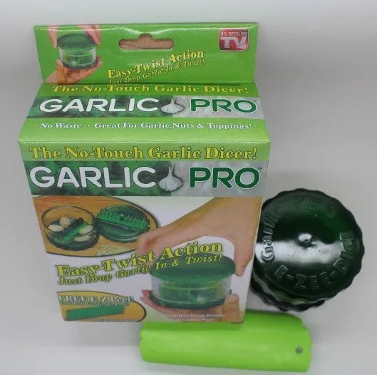 Green transparent PP plastic garlic peeler, 8.5 x 8.5 x 6 cm, on kitchen surface
