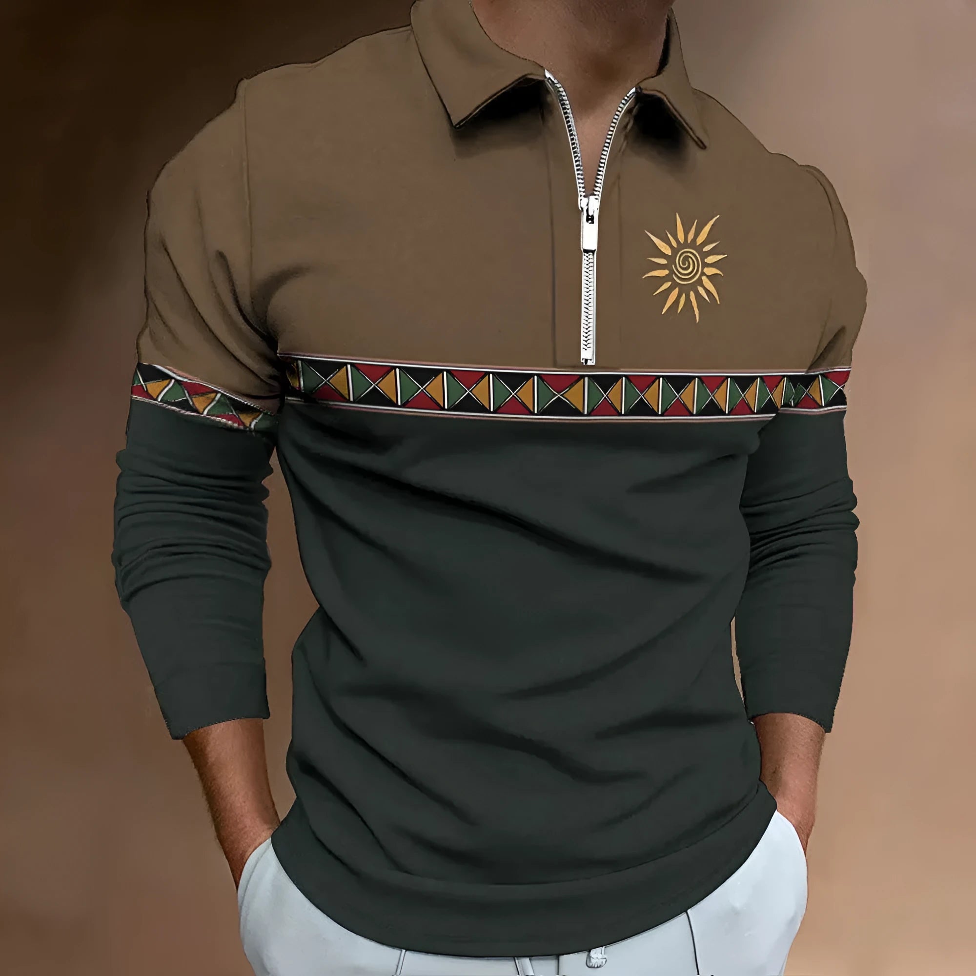Man wearing a long sleeve loose fit t-shirt with a retro striped print and zip detail decorations.