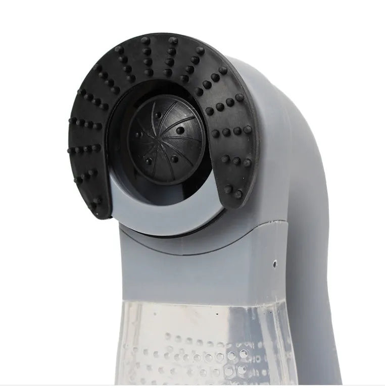 Grey portable electric pet hair remover vacuum with soft rubber grooming head for dogs and cats.