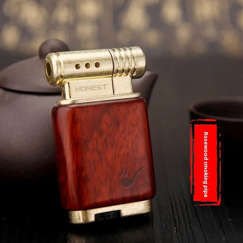 Ebony gas lighter with rosewood sun face design and black wood finish