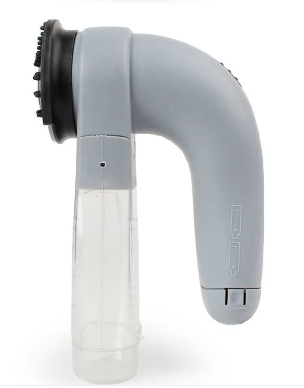 Grey portable electric pet hair remover vacuum with soft rubber grooming head for dogs and cats.