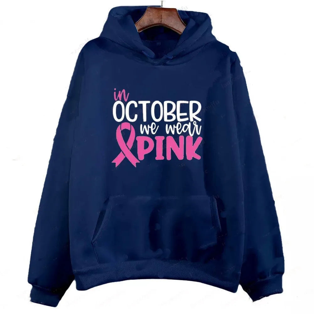 Women's pink sweatshirt with 'I'm A Survivor' retro graphic print and a side seam pocket.