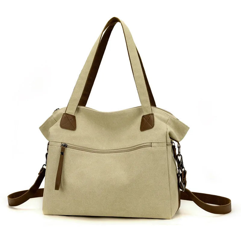 Women's retro style canvas shoulder bag in horizontal square shape with organisational compartments