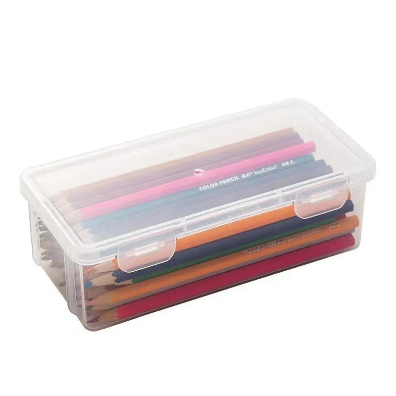 Transparent pencil storage box showing organised stationery including pencils and art supplies