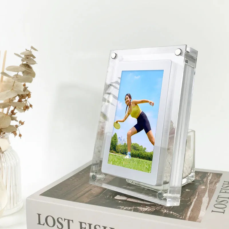White acrylic digital photo frame with 5-inch vertical screen showing family photos