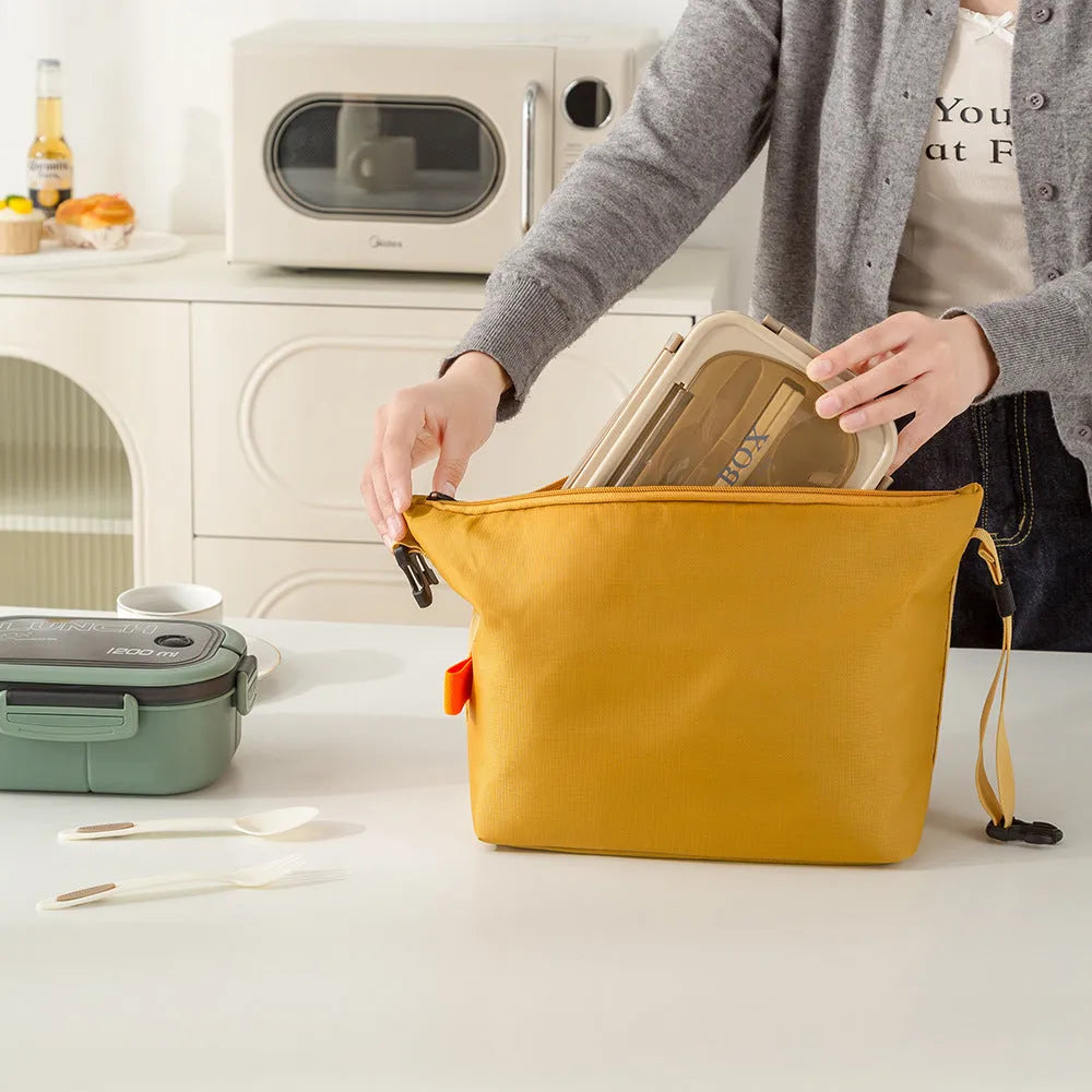 Japanese-style insulated lunch bag in Oxford cloth, shown in grey, black, yellow, and army green colours.