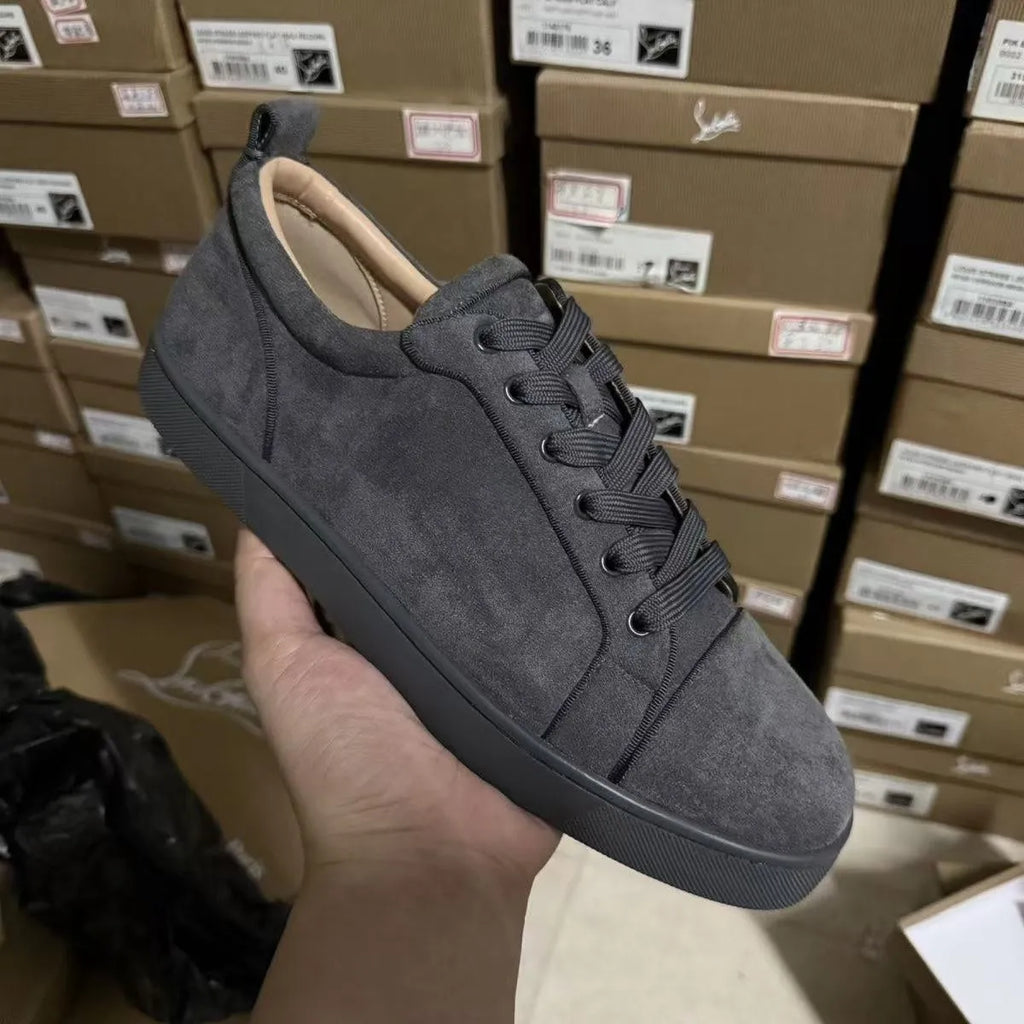Men's grey low-top casual sneakers with colour-block design, stitched rubber sole, and front lacing