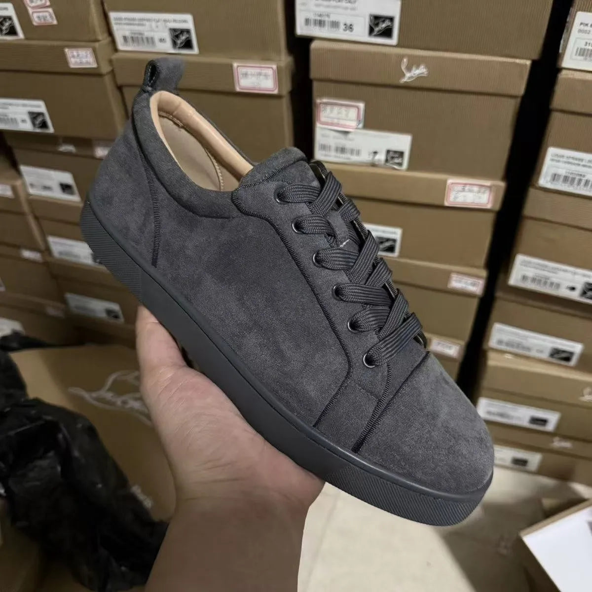 Men's grey low-top casual sneakers with colour-block design, stitched rubber sole, and front lacing