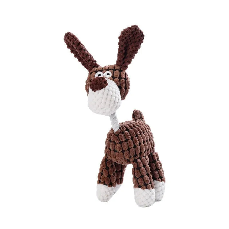 Assorted plush dog toys including a pink-gray donkey, a beige donkey, a blue elephant, and yellow ducks in three sizes.