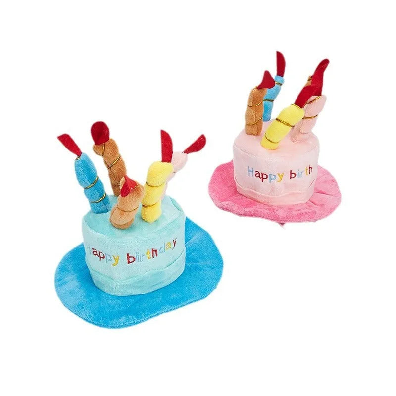 Blue and pink soft birthday hat for small dog on white background.