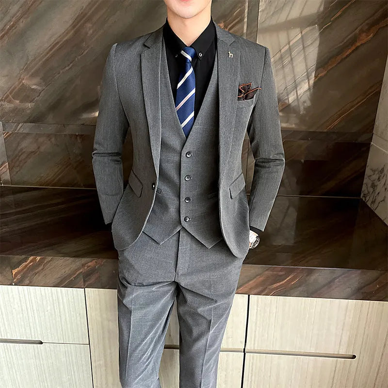 Slim fit men's business suit in black and dark grey options with British style design