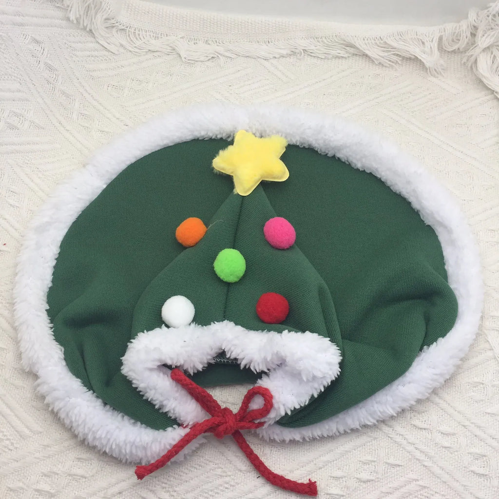 Cat Christmas cape with velvet stars hat in green, adjustable ties, side view on a cat