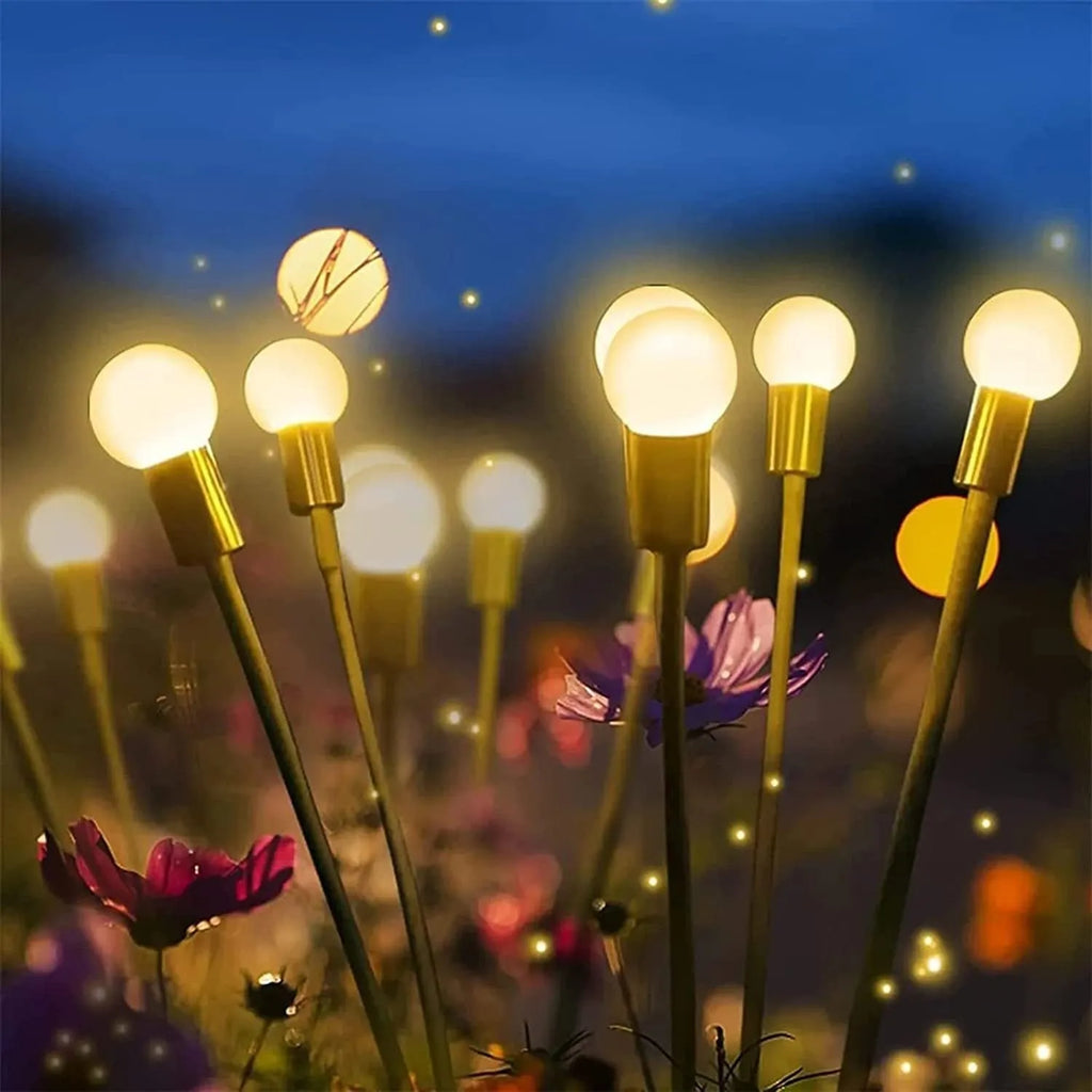 Solar-powered LED garden ground light with multiple light heads and a pneumatic foot pedal for installation.
