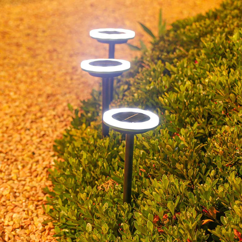 12LED rotating solar lawn light with IP65 rating in a garden setting, white light option, 103x103x340mm spike