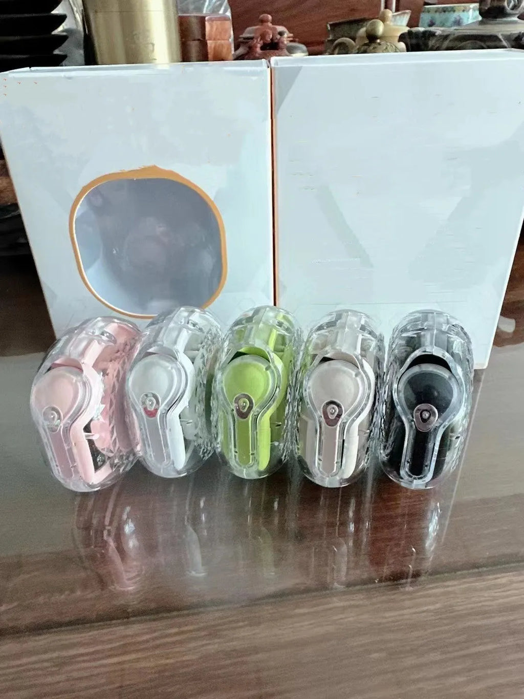 BT19 earclip wireless sports Bluetooth earphones in white with digital display and button controls