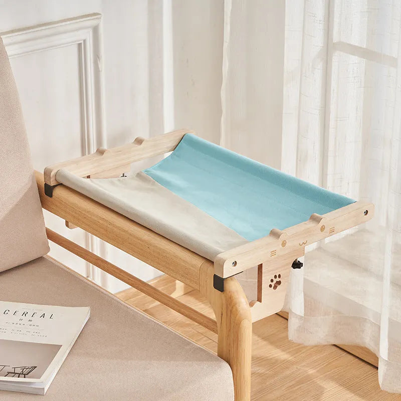 Wooden cat hanging bed mounted on window with suction cups, hammock-style pet sleeping area