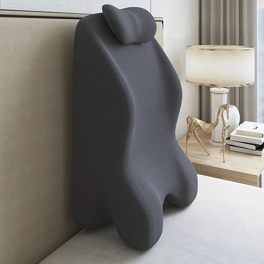 Stomach sleeper pillow in blue, designed for prone sleeping and reading.