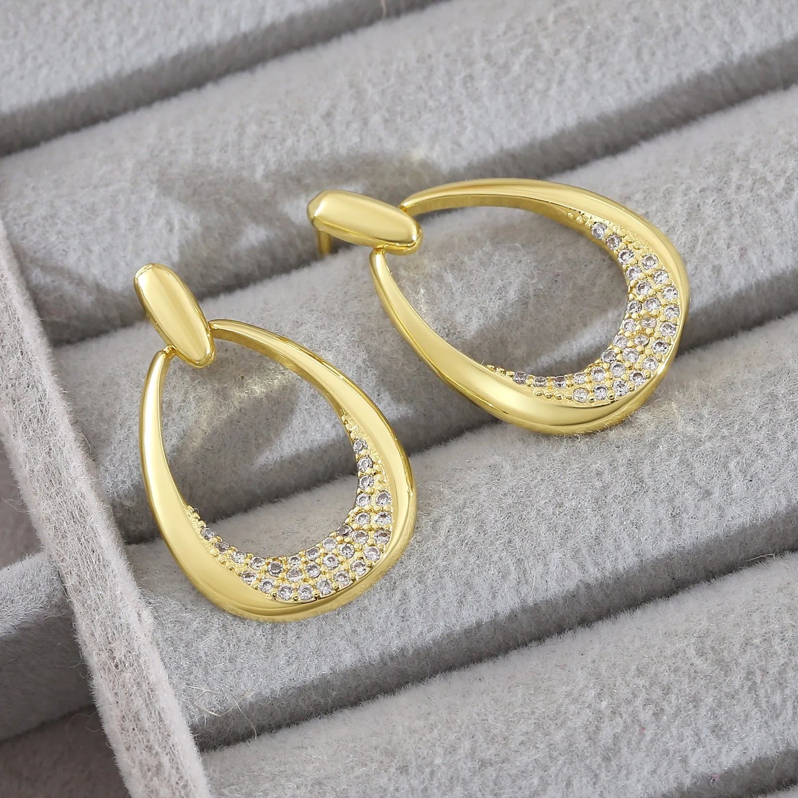 Yellow gold geometric drop earrings with zircon accents measuring 2.6cm x 1.7cm