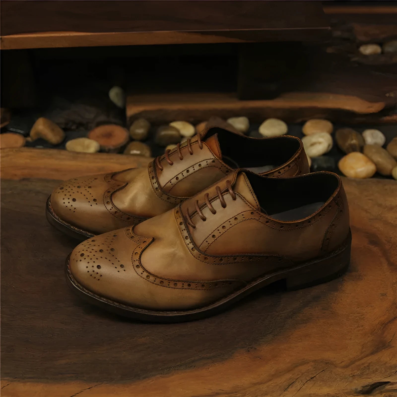 Light brown men's vintage distressed leather lace-up shoes with carved detailing on the upper.