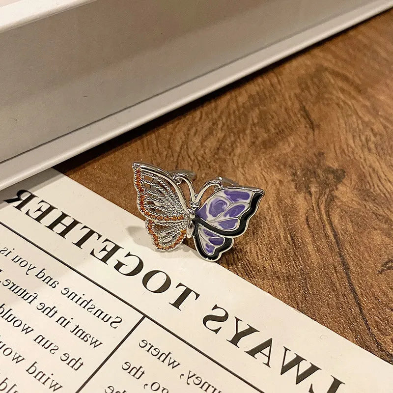 Simple copper women's ring with a Chinese butterfly design, showing an example from the 33 available numbered styles.