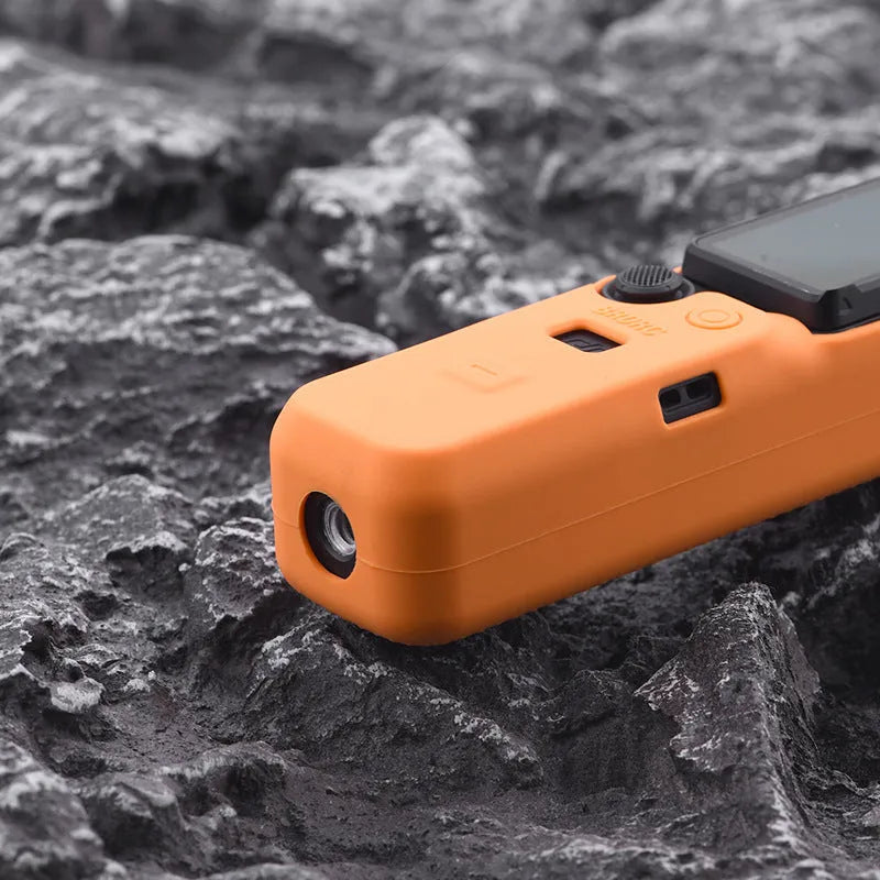 Black, red, and orange silicone protective sleeves for PTZ camera bodies in small and medium sizes