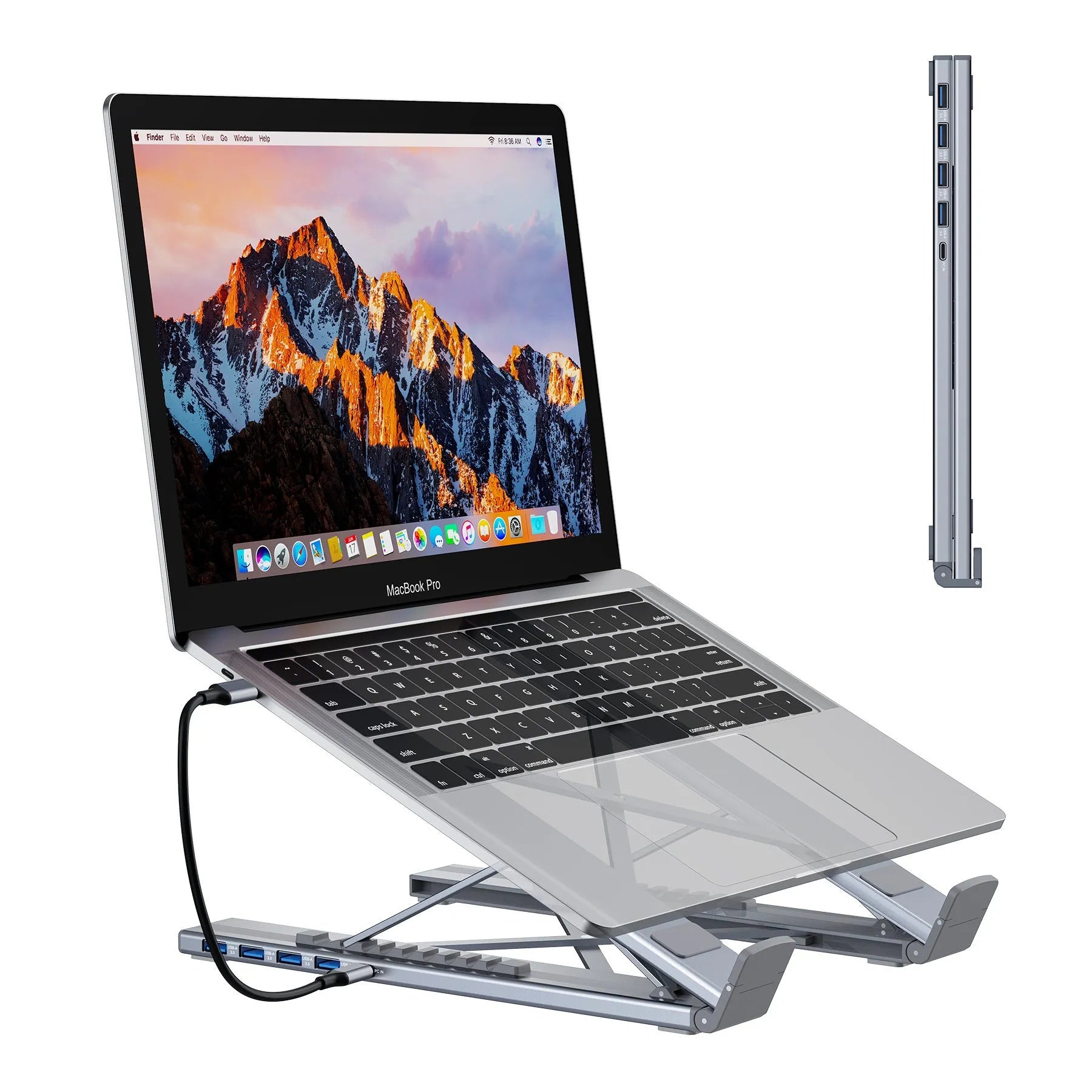 Silver aluminium folding laptop stand with integrated multi-port docking hub on a desk.