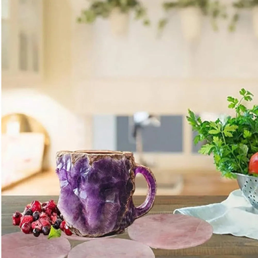 A purple resin coffee mug with a handle, showing a crystal-like structure, on a table.