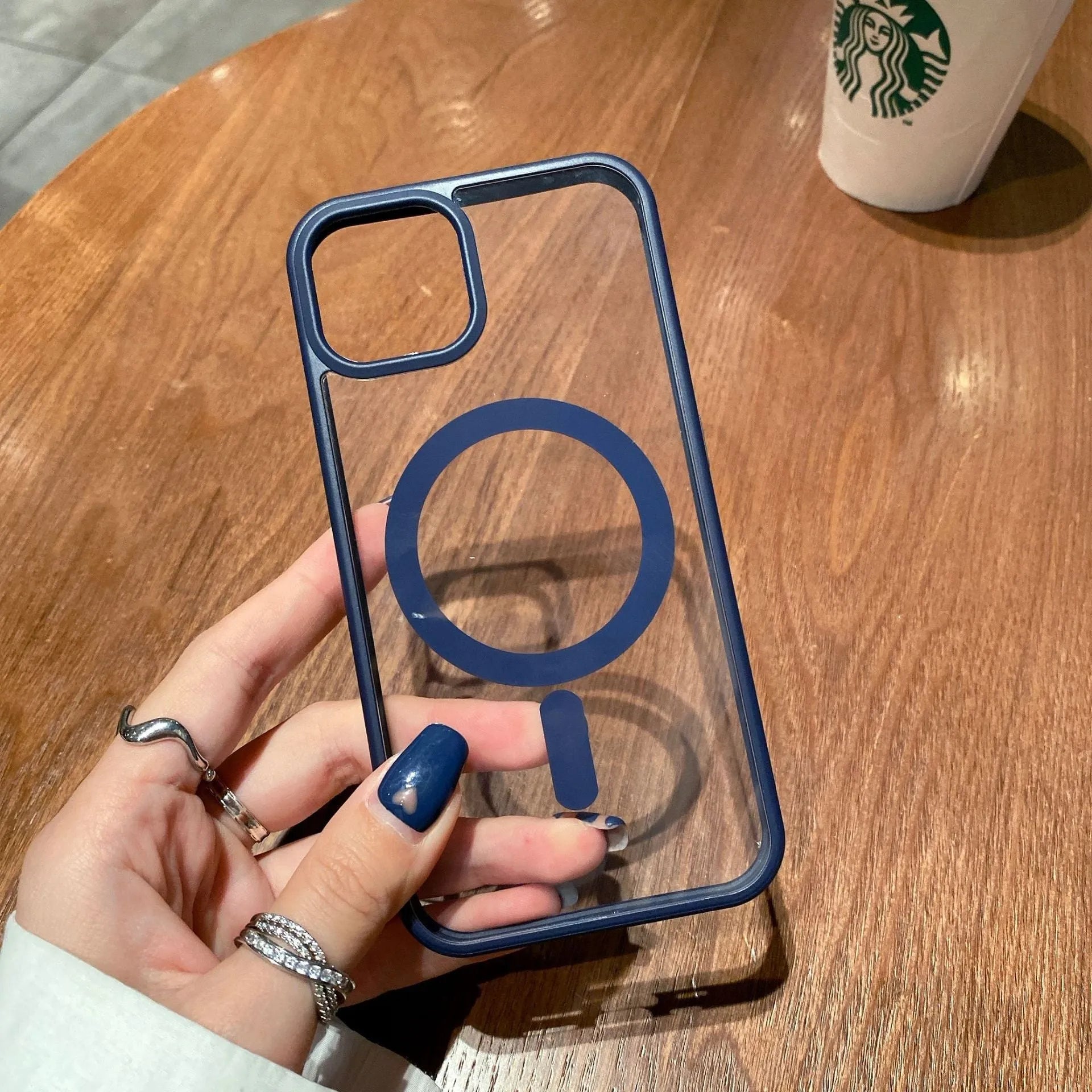 Transparent acrylic MagSafe phone case for iPhone 13 series, showing TPU edges and magnet ring
