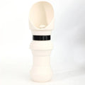 Soft silicone pet folding water cup shown in a choice of colours, collapsed and expanded next to a dog lead.