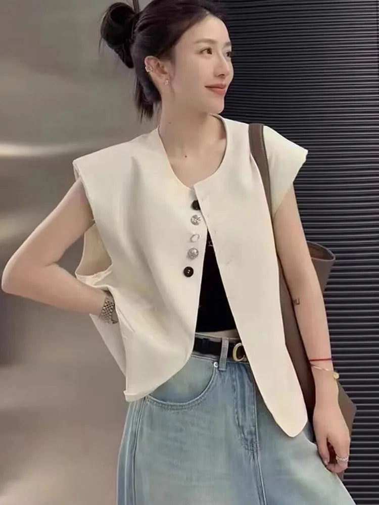 Women's loose-fit polyester vest in solid colour with a pocket, shown in milky white.