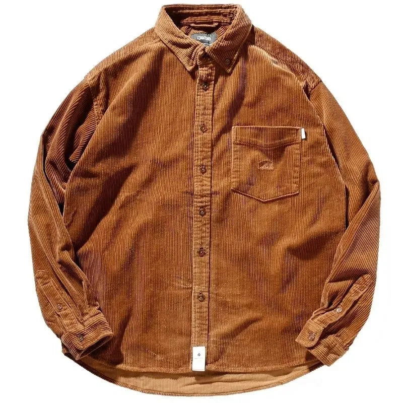 Man wearing a loose caramel corduroy long sleeve cardigan-style shirt