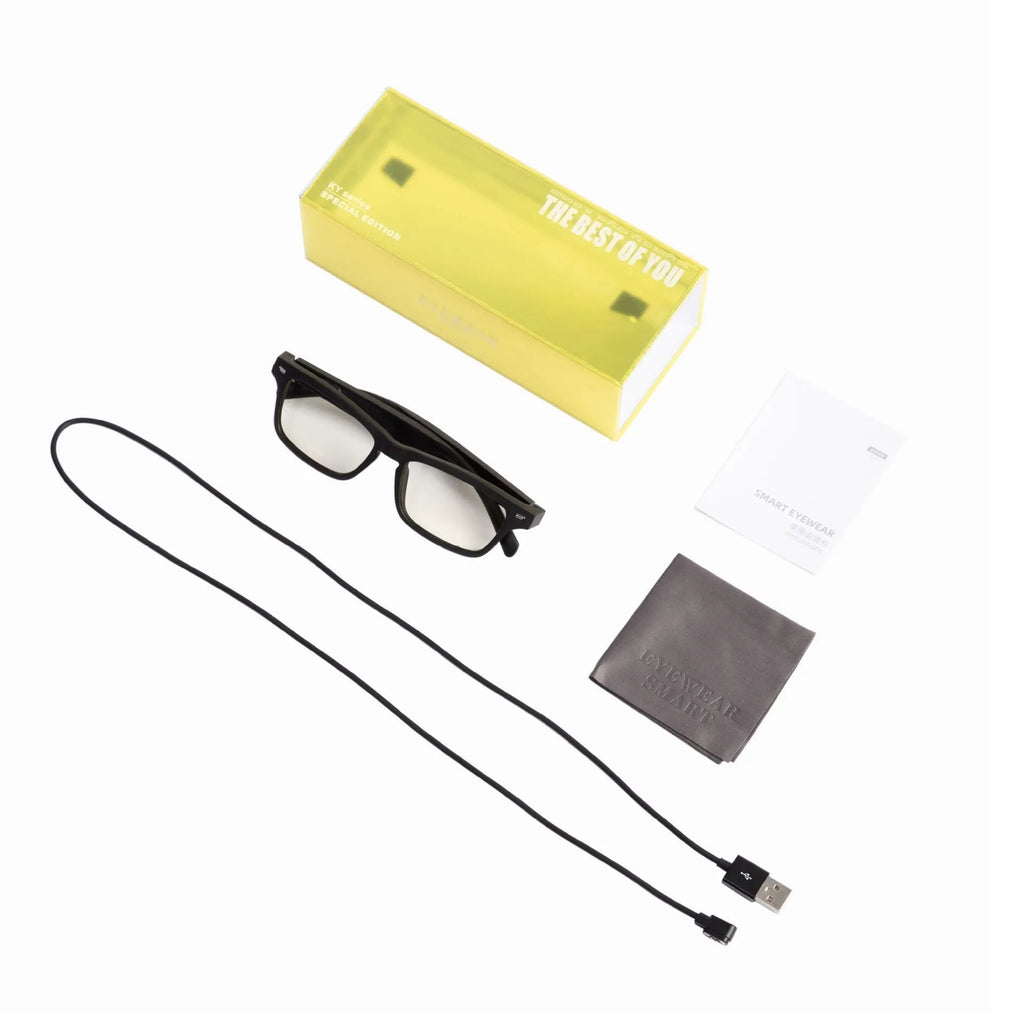 Smart sunglasses with black frame, polarised lenses, and built-in Bluetooth speakers in the temples.