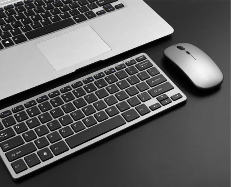 Compact 78-key Bluetooth wireless keyboard in silver white or black with USB charging interface