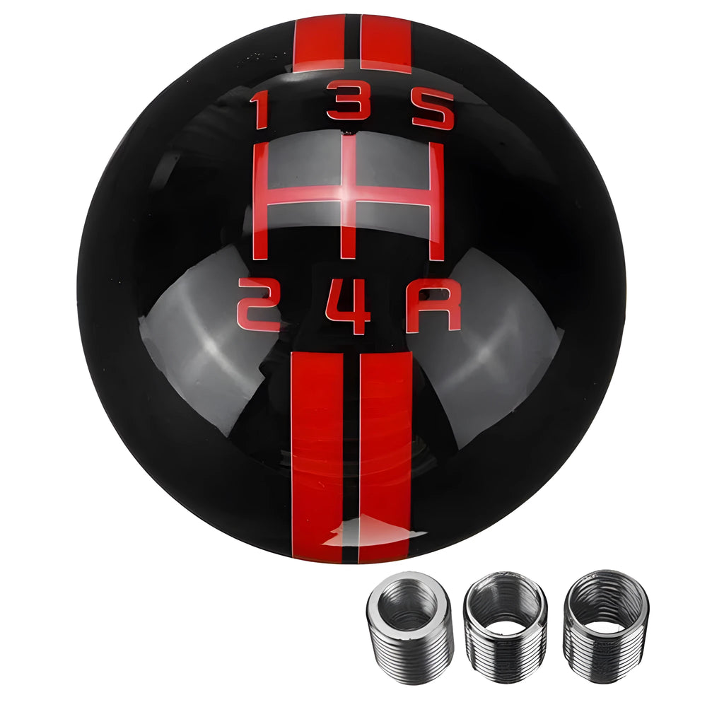 Close-up of a clear acrylic universal 5-speed manual gear head with black ball and red lettering on a car shift lever