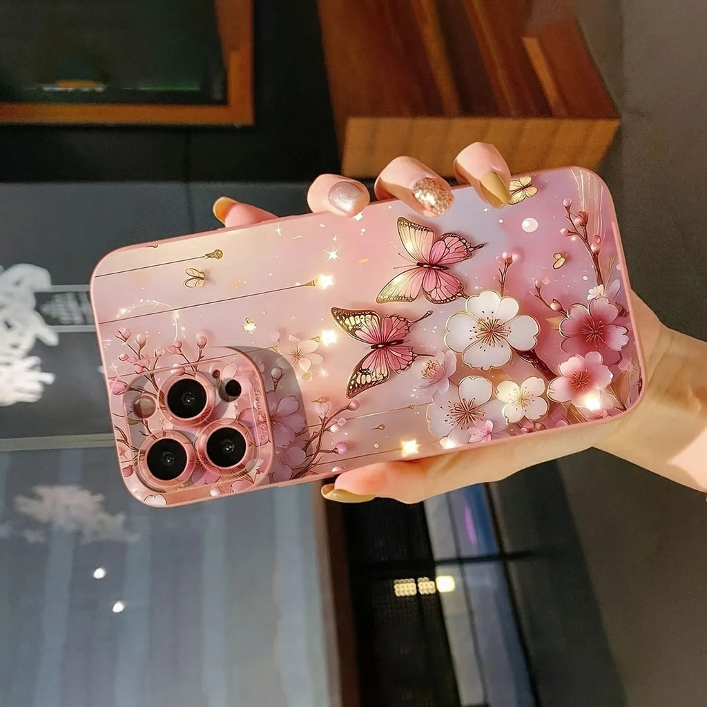 TPU soft shell phone case with butterfly design in pink for iPhone 15 Pro Max, showing protective edges and sprayed finish