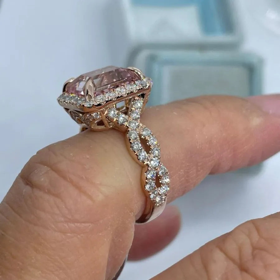 Rose gold coloured geometric alloy ring showing electroplated finish and angular design details