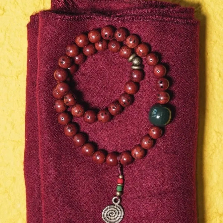 A handmade double circle bracelet crafted from natural bodhi seeds in a retro cartoon style.
