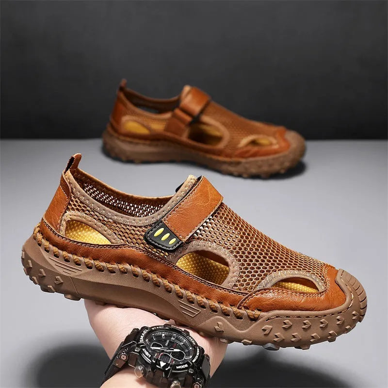 Men's casual sandals with black mesh upper, rubber sole, and adjustable Velcro strap.