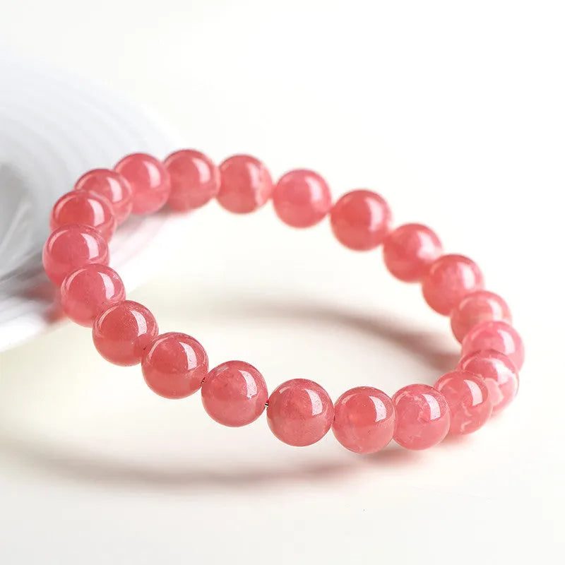Women's geometric design crystal bracelet with natural red rhodochrosite stones and longevity lock fastening
