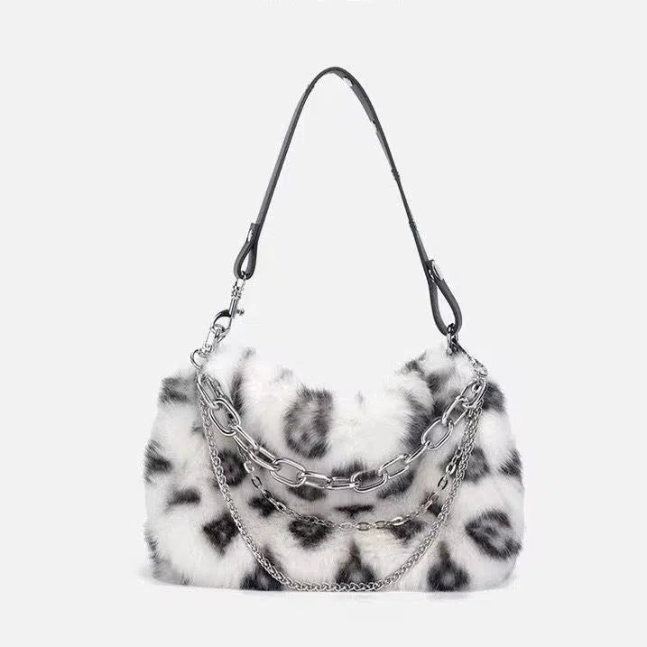 Plush luxury-style chain bag in apricot with leopard print and gold-tone chain, horizontal rectangular shape, soft texture.