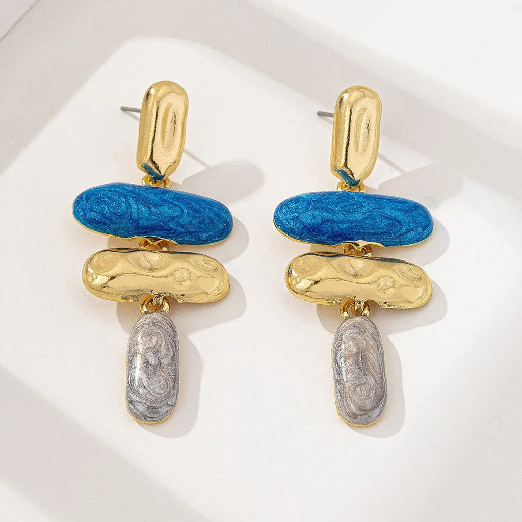 A pair of women's geometric stud earrings with a multicolour electroplated finish on a zinc alloy base.