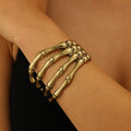 Retro hollow skull paw bracelet for women in antique bronze zinc alloy with electroplated finish