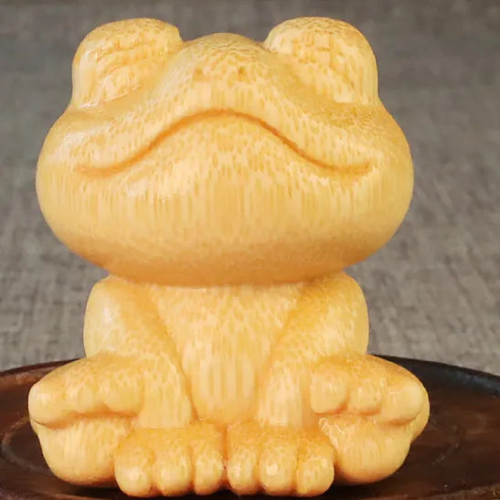 Solid bamboo carved smiling frog ornament with cartoon cute style, measuring 5cm high.