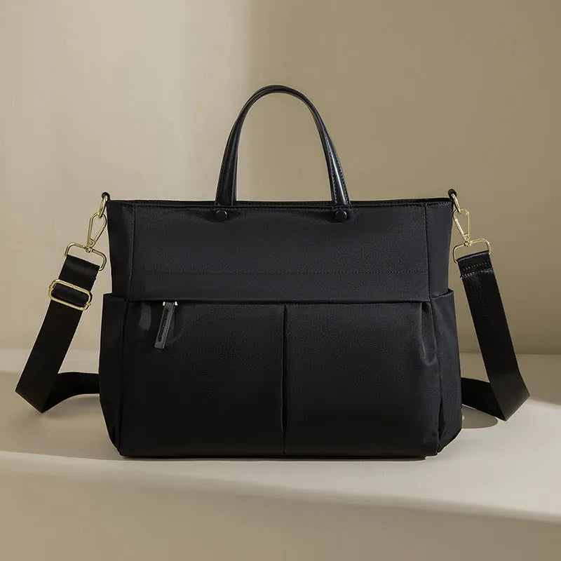 Women's oxford cloth portable briefcase in nuts and apricots colour with contrast stitching.
