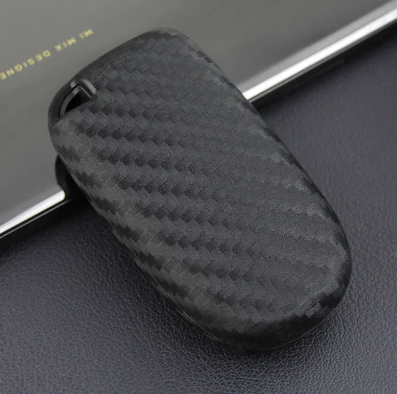 Black silicone car key case with carbon fibre pattern for Dodge, Chrysler, Fiat remote, shown with buckle option.