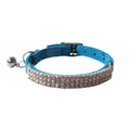 Soft flocked cat collar with elastic buckle in multiple colours on a white background.