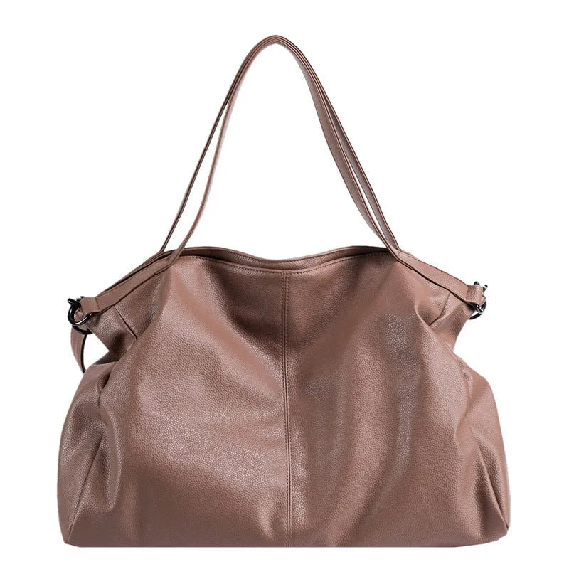 Large soft surface PU messenger tote bag in black with adjustable shoulder strap and zipper opening.
