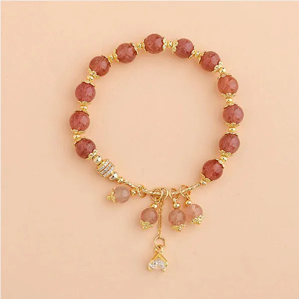 Pink crystal women's bracelet with heart-shaped charms and pearl decorative accents