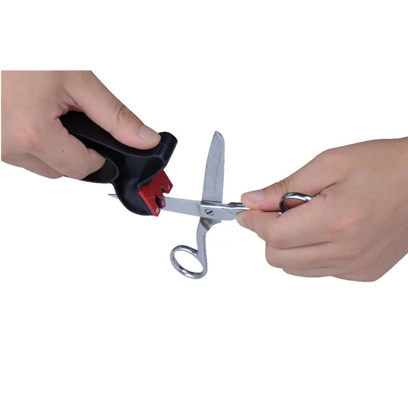 Handheld 2-in-1 black knife and scissor sharpener with tungsten steel blade on white background