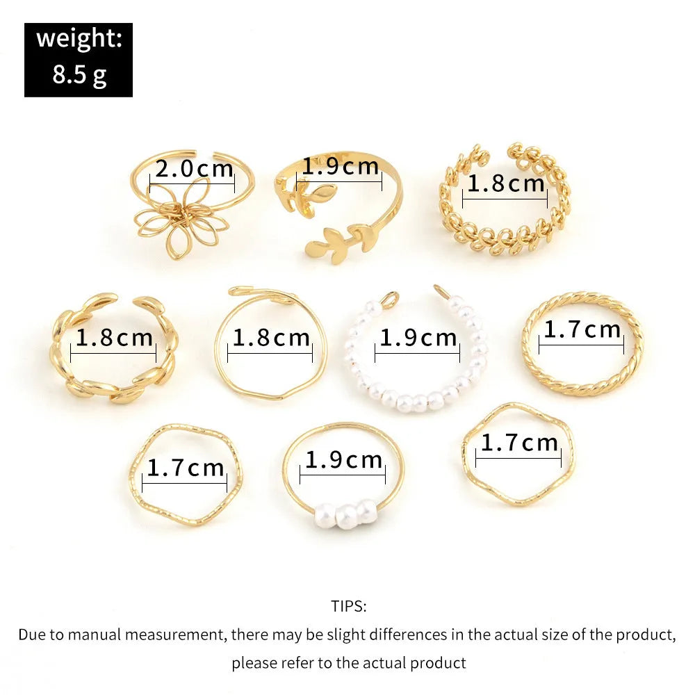 Gold openwork flower alloy ring with glossy electroplated finish on white background